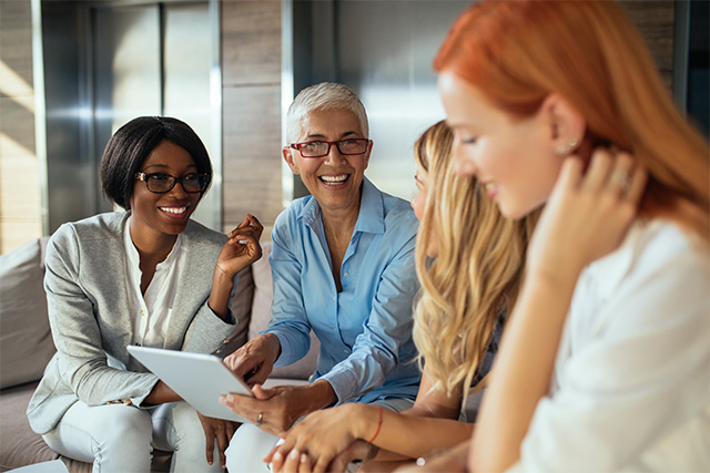 Working as part of a team meeting [Adobe Stock - bernardbodo]